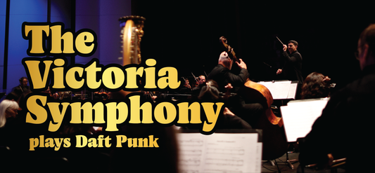 Musicians perform with string instruments on stage. Large yellow text reads: The Victoria Symphony plays Daft Punk. The conductor and orchestra are illuminated in a dimly lit concert hall.
