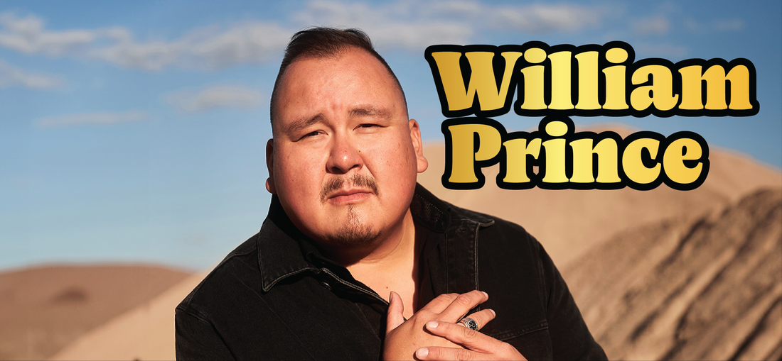 A man with short hair and a goatee stands outdoors against a desert landscape, looking at the camera with one hand on his chest. Large yellow text beside him reads, William Prince.